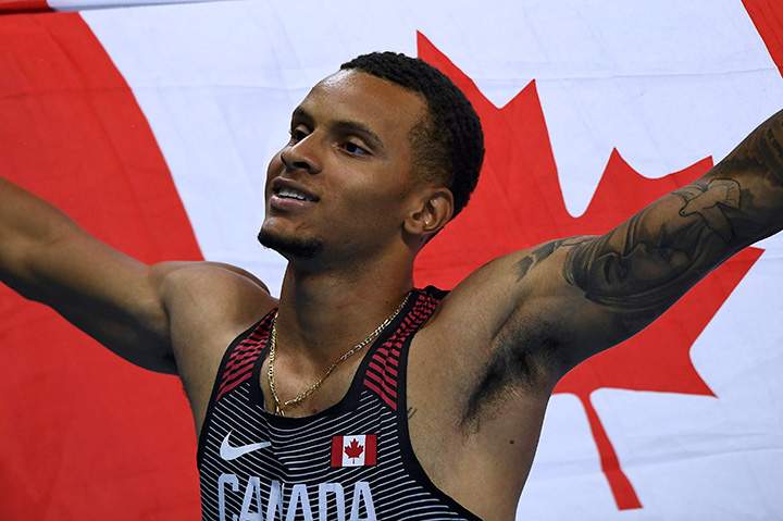 Canada’s Andre De Grasse celebrates after winning silver in the men’s 200-metre at Rio Olympics on August 18, 2016.