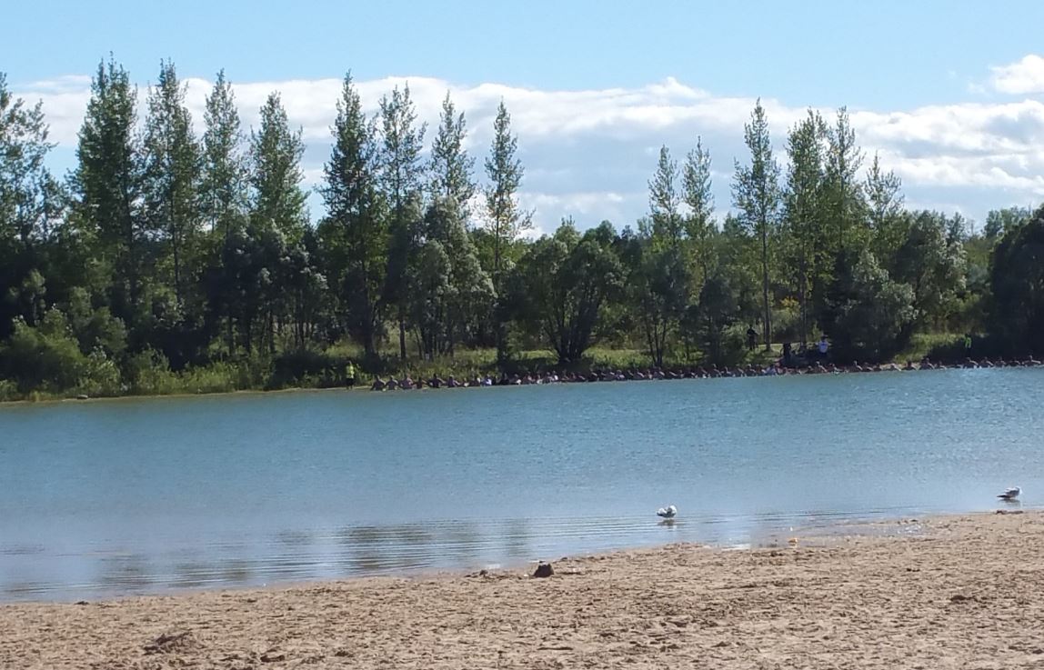 People searching the water at Birds Hill Provincial Park. 