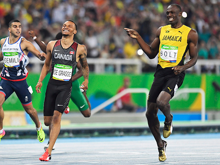 Canada’s Andre De Grasse and Jamaica’s Usain Bolt share a laugh as they compete during the men’s 200-metre semi-finals at the 2016 Summer Olympics in Rio de Janeiro, Brazil, Wednesday, August 17, 2016.