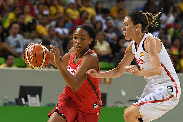 Canada’s shooting guard Nirra Fields works around Spain’s guard Anna Cruz during a women’s round Group B basketball at the Youth Arena in Rio de Janeiro on August 14, 2016 during the Rio 2016 Olympic Games.