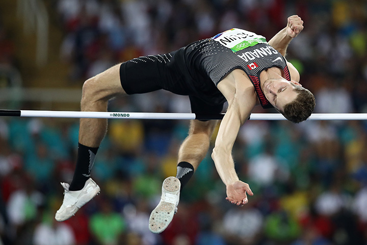 Canada’s Derek Drouin competes in the men’s high jump qualification on Day 9 of the Rio 2016 Olympic Games at the Olympic Stadium on August 14, 2016 in Rio de Janeiro, Brazil.