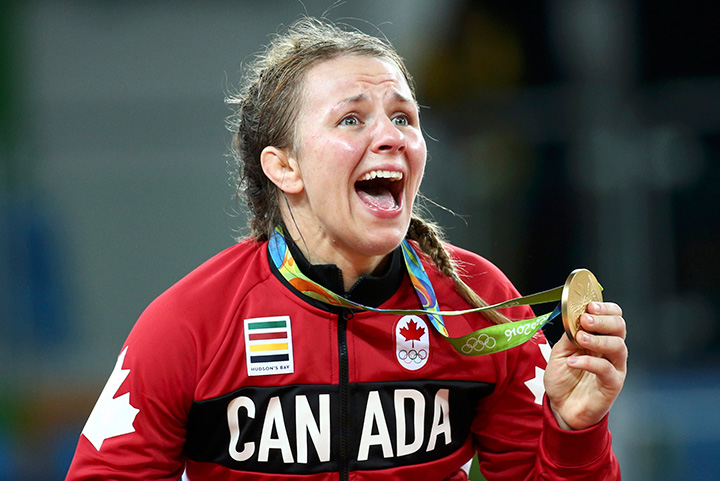 Canada’s Erica Wiebe reacts after receiving her gold medal.