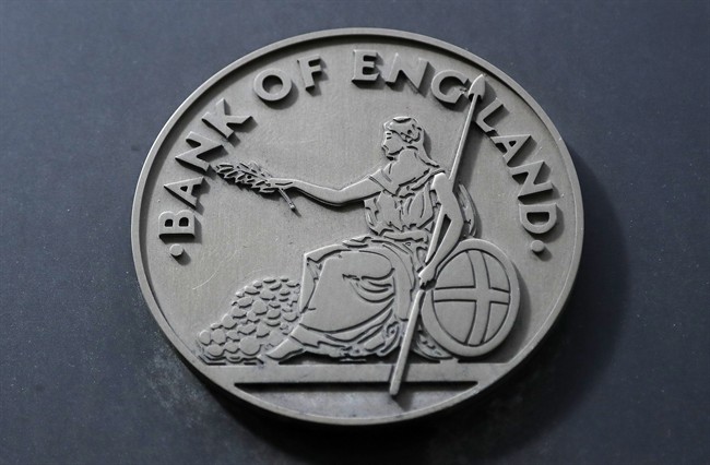 A Bank of England plaque is seen at the bank in London, Thursday, Aug. 4, 2016. The Bank of England cut interest rates close to zero and injected billions in new money into the economy to help it endure the shock of the vote to leave the European Union. (AP Photo/Frank Augstein)