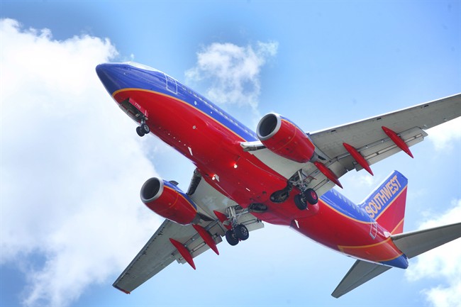 In a June 6, 2016, file photo, a Southwest Airlines jet gets ready to land at Tampa International Airport, in Tampa, Fla.