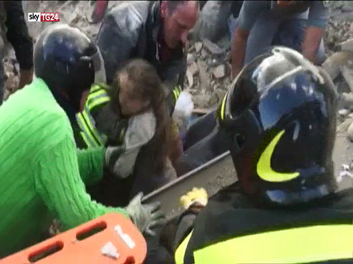 In this image taken from a video, a 10-year-old girl is pulled alive from the rubble following an earthquake in Pescara Del Tronto, Italy on Wednesday, Aug. 24, 2016.