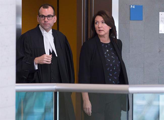 In this August 2016 file photo, former Quebec deputy premier Nathalie Normandeau, right, and her lawyer Maxime Roy arrive at the courthouse to face accusations of fraud and corruption.A judge ruled the trial will proceed despite lengthy delays. Monday, March 26, 2018.