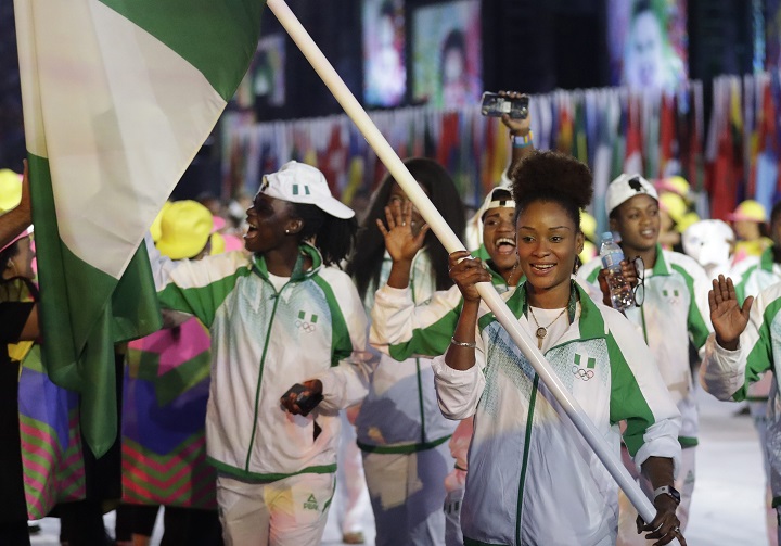 Olufunke Oshonaike carries the flag of Nigeria during the opening ceremony for the 2016 Summer Olympics in Rio de Janeiro, Brazil, Friday, Aug. 5, 2016.