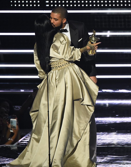 Rihanna kisses Drake as she accepts the Michael Jackson Video Vanguard Award at the MTV Video Music Awards at Madison Square Garden on Sunday, Aug. 28, 2016, in New York.
