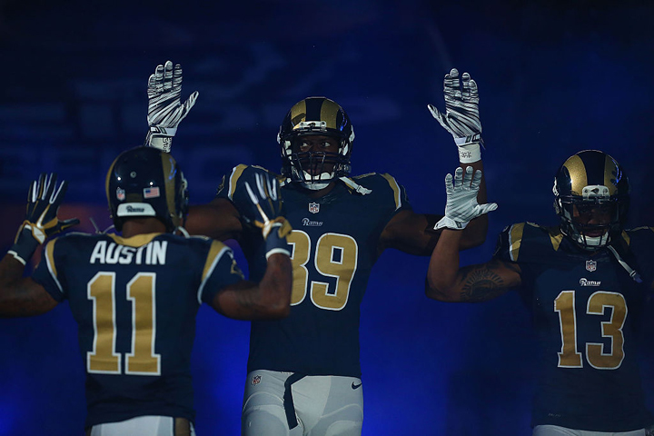 Tavon Austin #11, Jared Cook #89, Chris Givens #13 of the St. Louis Rams pay homage to Mike Brown. (Dilip Vishwanat/Getty Images)