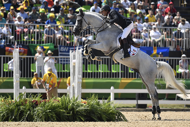 France’s Philippe Rozier, riding Rahotep de Toscane, takes part in the jumping competition at the Olympic Equestrian Centre during the Rio 2016 Olympic Games in Rio de Janeiro on August 17, 2016.