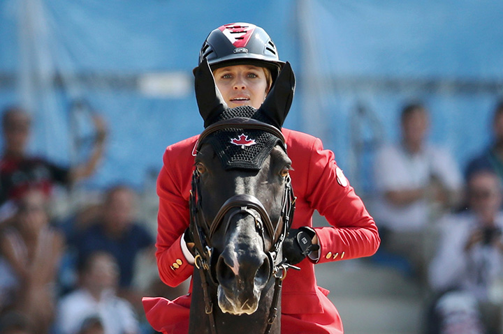 Canada’s Tiffany Foster, riding Tripple X III, competes during the equestrian jumping final on August 19, 2016.