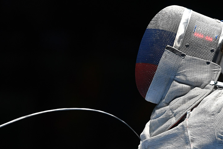 Russia’s Nikolay Kovalev competes against Italy’s Aldo Montano during their men’s individual sabre fencing event of the Rio 2016 Olympic Games on August 10, 2016.