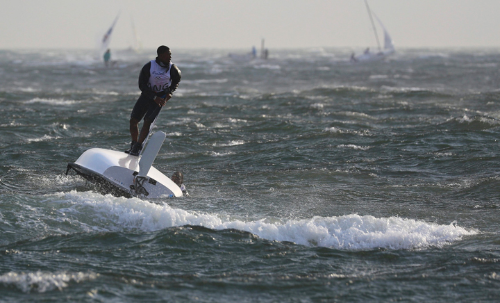 Matias Montinho (ANG) of Angola and Paixao Afonso (ANG) of Angola capsize after the wind suddenly shifted and increased.