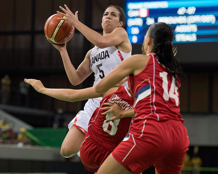 Canada’s Kia Nurse drives through Serbia’s Nevena Jovanovic and Ana Dabovic (14) on her way to the hoop during their preliminary round basketball match at the 2016 Summer Olympics Monday, August 8, 2016 in Rio de Janeiro, Brazil.