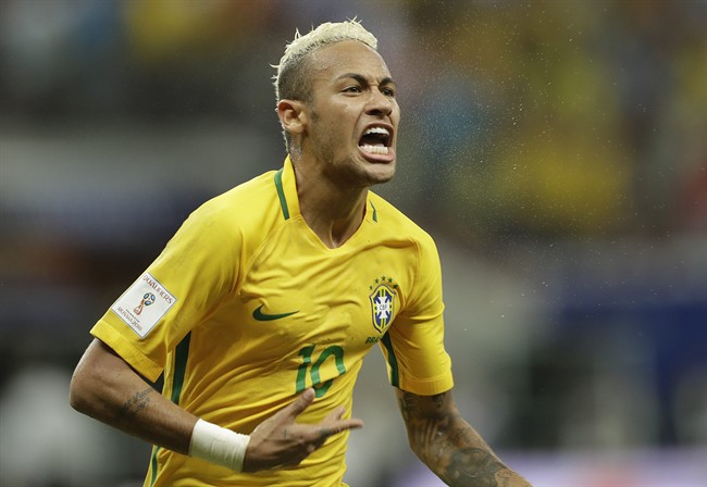 Brazil's Neymar celebrates scoring his side's 2nd goal against Colombia during a 2018 World Cup qualifying soccer match in Manaus, Brazil.