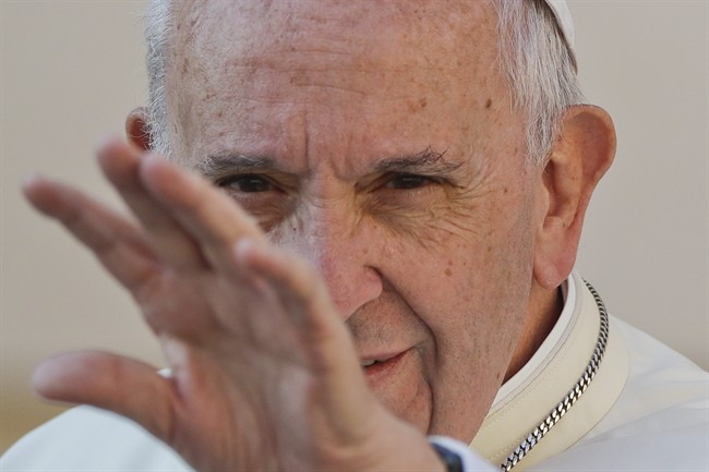 Pope Francis waves to the faithful as he arrives for his weekly general audience, in St. Peter's Square, at the Vatican, Wednesday, Sept. 28, 2016.