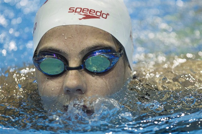 FILE - Canadian swimmer Aurelie Rivard and wheelchair racer Brent Lakatos broke Paralympic records in their respective morning heats on Friday at the Paralympic Games. Rivard swims during a media availability as the Canadian Paralympic Swim Team for Rio 2016 is announced in Toronto in an August 29, 2016, file photo. 