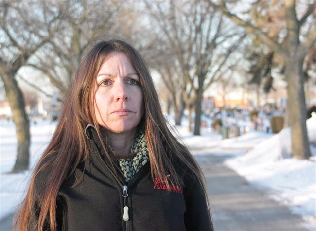 Denise Stark, mother of Cpl. Justin Stark, is seen at the cemetery where her son is buried in Hamilton, Ont., on Thursday, March 6, 2014. The mother of a Canadian soldier who killed himself after serving in Afghanistan will finally be honoured with a Memorial Cross this weekend, ending a long battle to have the military recognize his death as service related.