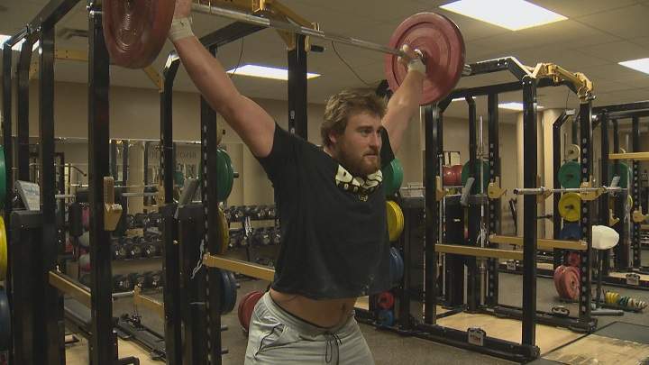 Manitoba Bisons offensive lineman Geoff Gray trains inside the team's gym.