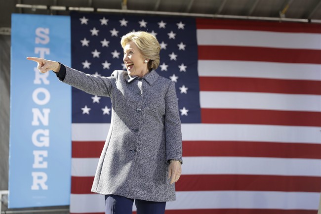 Democratic presidential candidate Hillary Clinton gestures as she takes the stage during a campaign stop in Des Moines, Thursday, Iowa, Sept. 29, 2016. 
