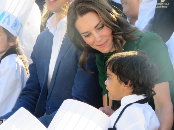 Kate, Duchess of Cambridge, chats with a young boy at a culinary event at Mission Hill Winery Sept. 27, 2016.