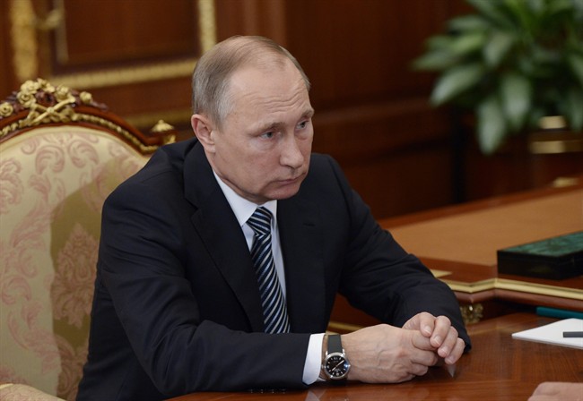 Russian President Vladimir Putin listens during a meeting with VTB CEP Andrei Kostin in Moscow's Kremlin on Tuesday, Sept. 27, 2016.