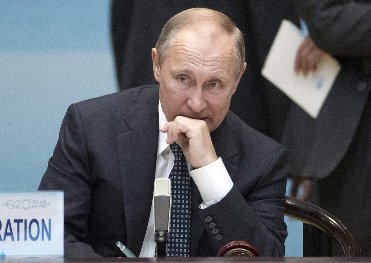 Russian President Vladimir Putin sits before the start of the opening ceremony of the G-20 Summit in Hangzhou in eastern China's Zhejiang province, Sunday, Sept. 4, 2016. 