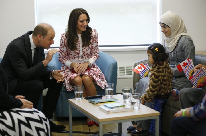 Britain’s Prince William, and Kate, Duchess of Cambridge meet with a family from Syria during a visit to the Immigrant Services Society in Vancouver, B.C., Sunday, Sept. 25, 2016.