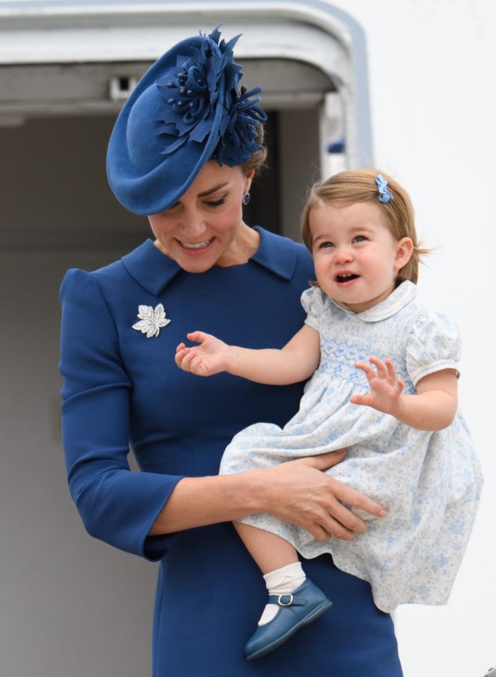 The Duchess of Cambridge and Princess Charlotte stepping off the plane.