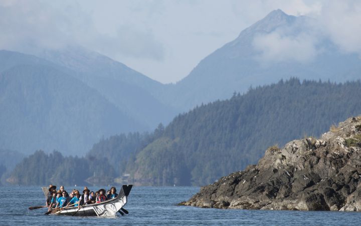 The Duke and Duchess of Cambridge paddle with a group in a traditional Haida canoe in the waters of Haida Gwaii, Friday, Sept. 30, 2016.