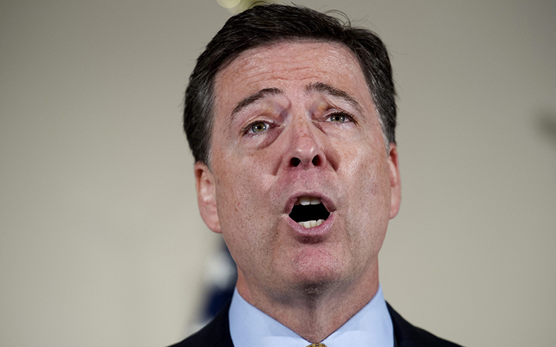 FBI Director James Comey makes a statement at FBI Headquarters in Washington regarding its investigation into Hillary Clinton's use of a private email server while secretary of state. 