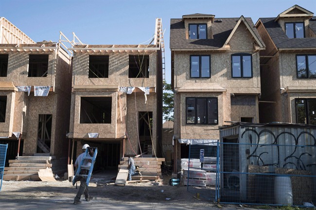 Houses under construction in Toronto are seen in a June 26, 2015, file photo. 