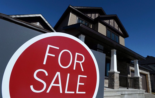 A sign advertises a new home for sale in Carleton Place, Ont., on March 17, 2015.
