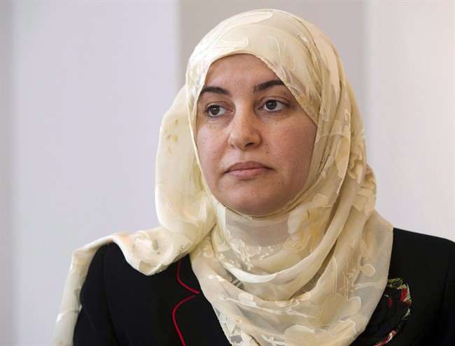 Rania El-Alloul takes part in a news conference Friday, March 27, 2015, in Montreal. A judge's decision to deny a woman's day in court because of her hijab goes against the principles of Canadian law, another Quebec tribunal has ruled.   Thursday, Oct. 6, 2016.