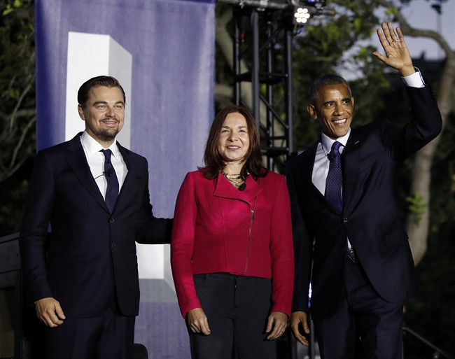President Barack Obama, right, arrives with actor Leonardo DiCaprio, left, and Dr. Katharine Hayhoe, to talk about climate change as part of the White House South by South Lawn event in Washington, D.C., Oct. 3, 2016. (AP Photo/Carolyn Kaster)