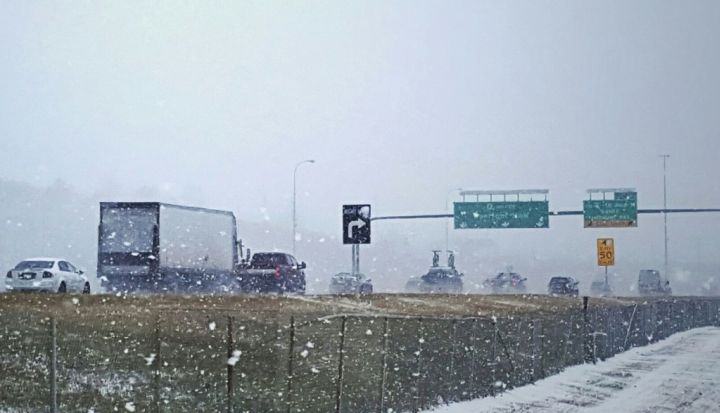 Snow falling on Calgary’s Deerfoot Trail Oct. 7, 2016.