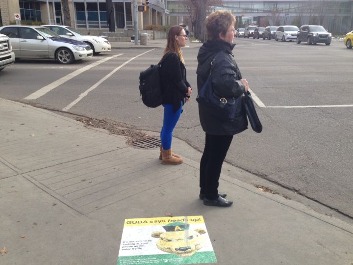 The University of Alberta is testing a $2,500 pilot program aimed at improving pedestrian safety through decals promoting road awareness.