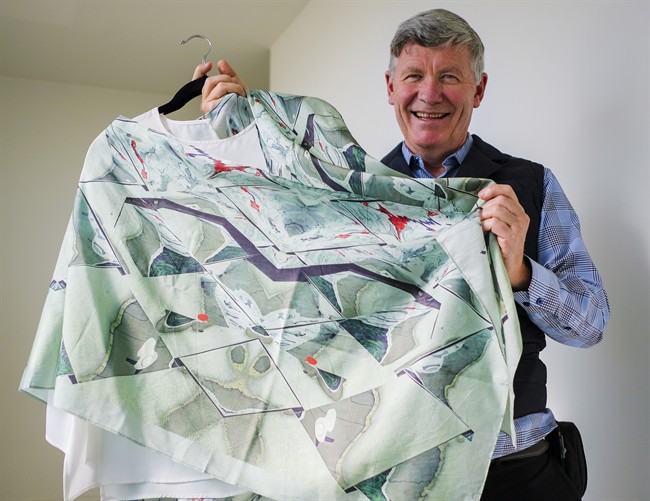 Former oil and gas executive turned fashion designer, Jean-Michel Gires, displays his colourful scarves at a studio in Calgary, Alta., Thursday, Oct. 6, 2016.