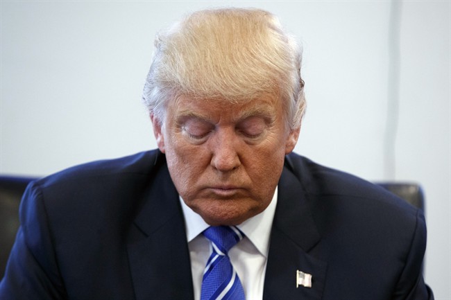 Republican presidential candidate Donald Trump pauses during a meeting with members of the National Border Patrol Council at Trump Tower, Friday, Oct. 7, 2016, in New York.