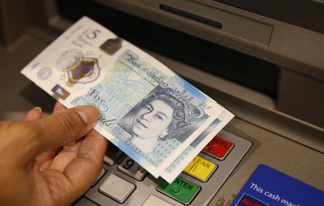 The British pound surged Thursday. (AP Photo/Alastair Grant, File).
