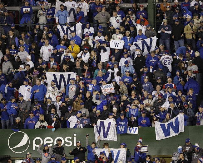 Fans celebrate after Game 5 of the Major League Baseball World Series between the Cleveland Indians and the Chicago Cubs Sunday, Oct. 30, 2016, in Chicago. 