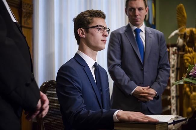 Nineteen-year-old Sam Oosterhoff is sworn in as the youngest-ever member of the Ontario legislature as Ontario PC Leader Patrick Brown, right, looks on in Toronto Wednesday, November 30, 2016. The Progressive Conservative was elected Nov. 17 in a byelection in Niagara West-Glanbrook, previously held by former party leader Tim Hudak. THE CANADIAN PRESS/Christopher Katsarov.