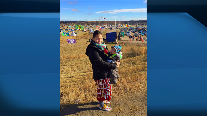 Danna Henderson, from the Pasqua First Nation, with her son Daynyn at Standing Rock.