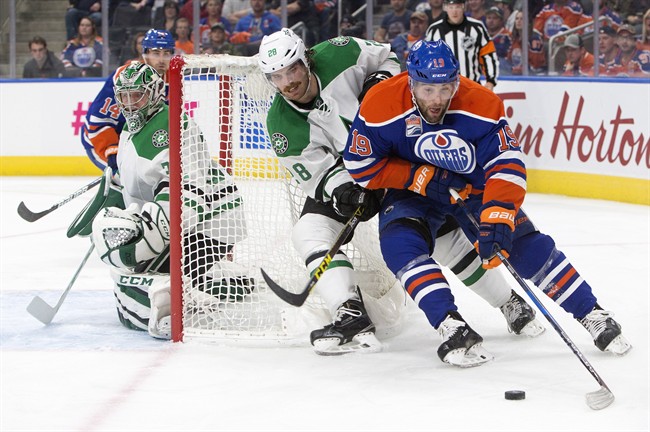 Dallas Stars' Stephen Johns (28) gives chase on Edmonton Oilers' Patrick Maroon (19) as goalie Kari Lehtonen (32) looks for the puck during second period NHL action in Edmonton, Alta., on Friday November 11, 2016. 