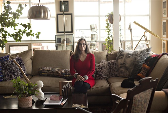 PhD Professor, Department of English Special Advisor to the University, Indigenous Initiatives Executive Director, Centre for the Advancement of Faculty Excellence MacEwan University, Valerie Henitiuk, is pictured at her home with variations of the book "Harpoon of the Hunter," in Edmonton, Alta., on Friday, November 11, 2016. An academic is dusting off a text considered the first Inuit novel in an effort to understand the travels and many translations of an almost-forgotten Canadian classic: "Harpoon of the Hunter.".