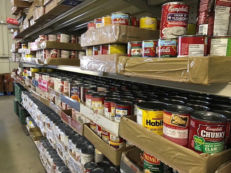 Cans on a shelf inside a Lethbridge food bank.