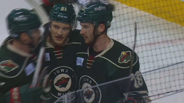 The Iowa Wild celebrate after scoring into the empty net in their 3-1 win over the Manitoba Moose on Wednesday.
