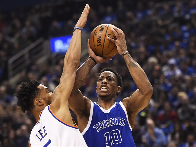 Toronto Raptors guard DeMar DeRozan (10) shoots past New York Knicks guard Courtney Lee (5) during first half NBA basketball action in Toronto on Saturday, November 12, 2016.