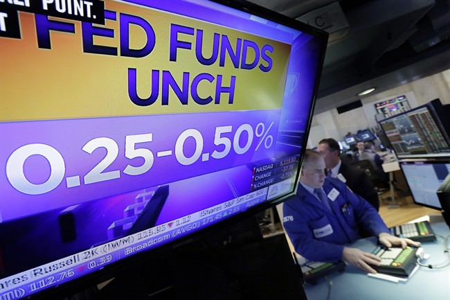 A television monitor on the floor of the New York Stock Exchange shows the decision of the Federal Reserve, Wednesday, Nov. 2, 2016. The Federal Reserve is leaving interest rates unchanged just days before Americans choose a new president, but hints again that it will likely raise rates at an upcoming meeting. 