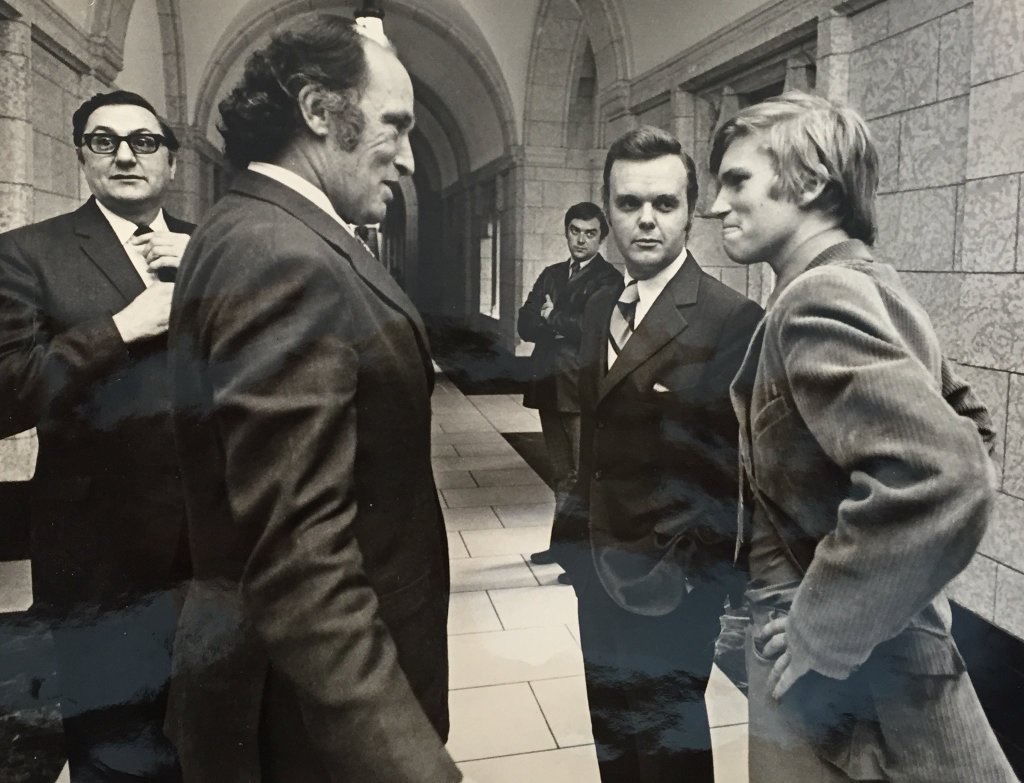A young Tom Clark (right) chats with former prime minister Pierre Trudeau on Parliament Hill. (Credit: @TomClarkTV, Twitter)